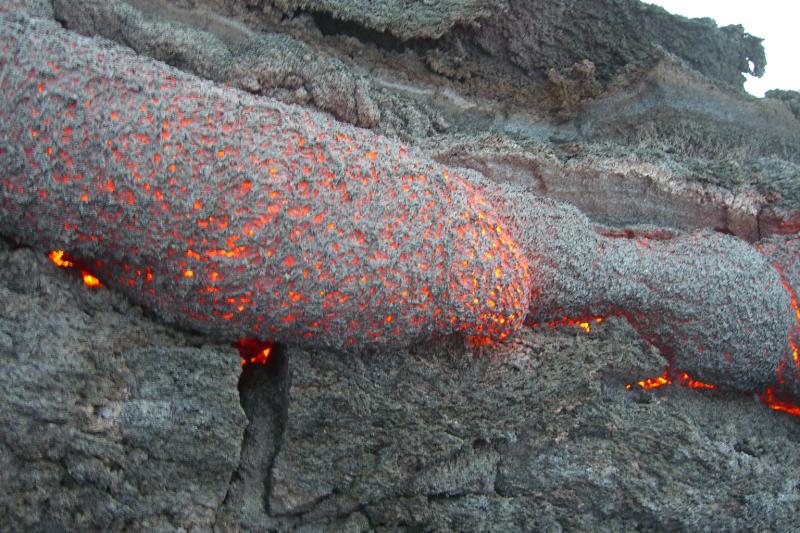 Volcan Pacaya-s.JPG - Lava oozes out of the ground, cools at the surface and continues to flow underground.